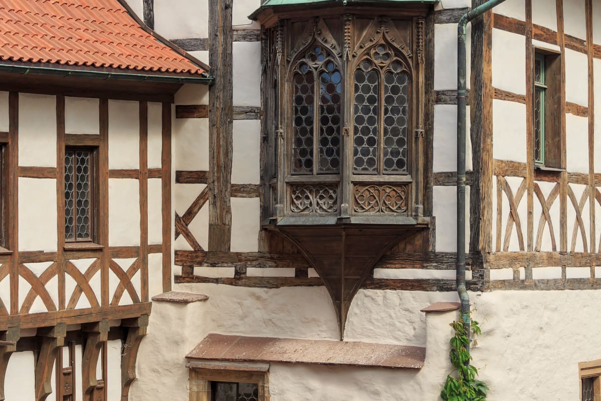 Wartburg Castle above Eisenach, Thuringia — a Romanesque castle on a forested ridge, where Martin Luther translated the New Testament in 1521–22 and St Elisabeth of Hungary lived in the 13th century. UNESCO 1999.